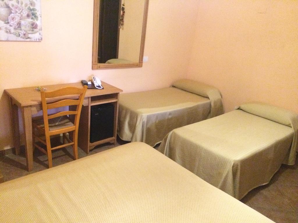 Albergo Arinde Rende Rum bild